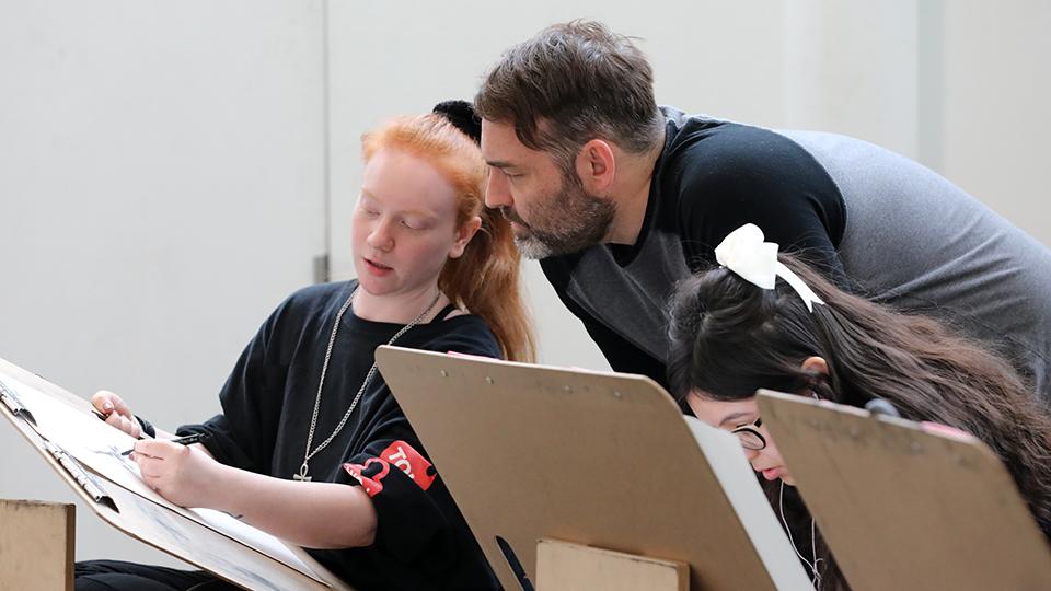 Professor working with a drawing student